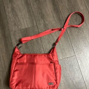 PacSafe red crossbody bag